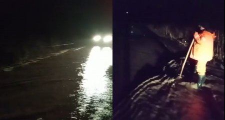 Circulatie oprita pe un drum din Harghita, dupa ce un <span style='background:#EDF514'>PARAU</span> a inundat carosabilul. Pe alte drumuri din zona a fost semnalat polei | VIDEO