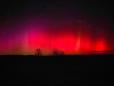 Fenomen rar pe cer, in Romania. Au aparut lumini rosii care seamana cu o <span style='background:#EDF514'>AURORA BOREALA</span>. FOTO