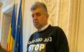 FOTO. Premierul Marcel Ciolacu a venit imbracat cu un tricou la Parlament, pe care era scris un <span style='background:#EDF514'>NUMAR DE TELEFON</span>