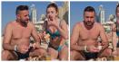 Un cuplu de romani a mancat <span style='background:#EDF514'>SLANINA CU CEAPA</span>, pe plaja, in Dubai. Reactii hilare pe internet. VIDEO