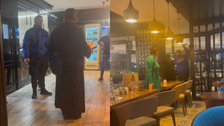 Un barbat imbracat in straie monahale, batut de agentul de paza al unui restaurant din Focsani