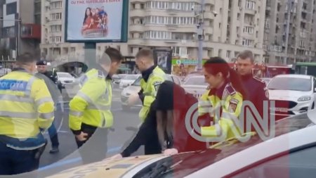 <span style='background:#EDF514'>MOMENTUL</span> in care o femeie este incatusata in fata Guvernului. Detalii despre operatiunea politistilor din Bucuresti