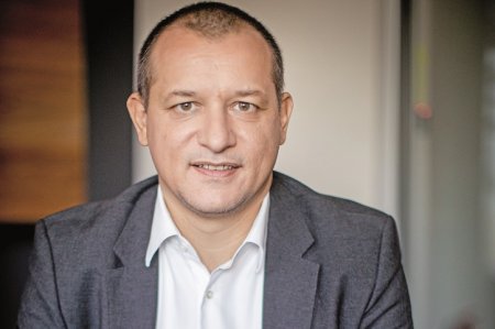 Cristian Sporis, vicepresedinte Raiffeisen Bank, primeste un nou an de mandat in functia de presedinte al AmCham Romania