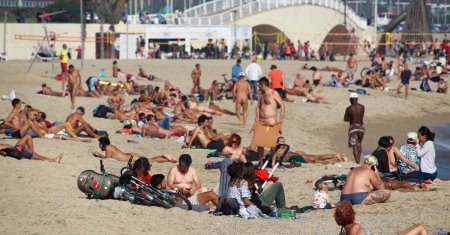 Vreme foarte calda in Spania si <span style='background:#EDF514'>PORTUGALIA</span>. Plajele sunt pline, vanzarile de inghetata au explodat