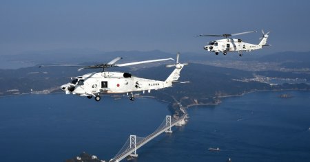 Prabusirea in <span style='background:#EDF514'>OCEANUL</span> Pacific a celor doua elicoptere militare japoneze, invaluita in mister. Cautarile continua